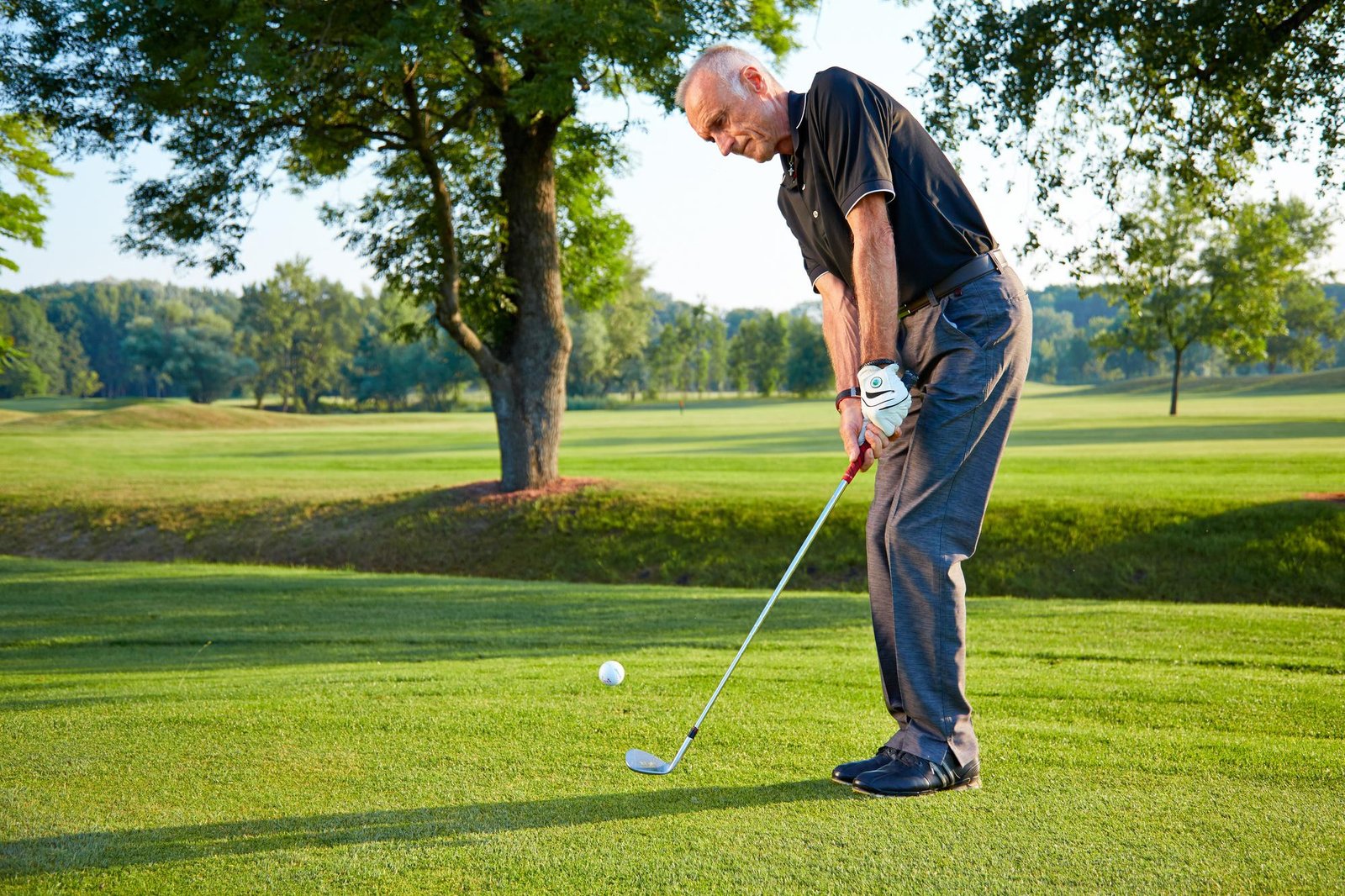 a man playing golf short game